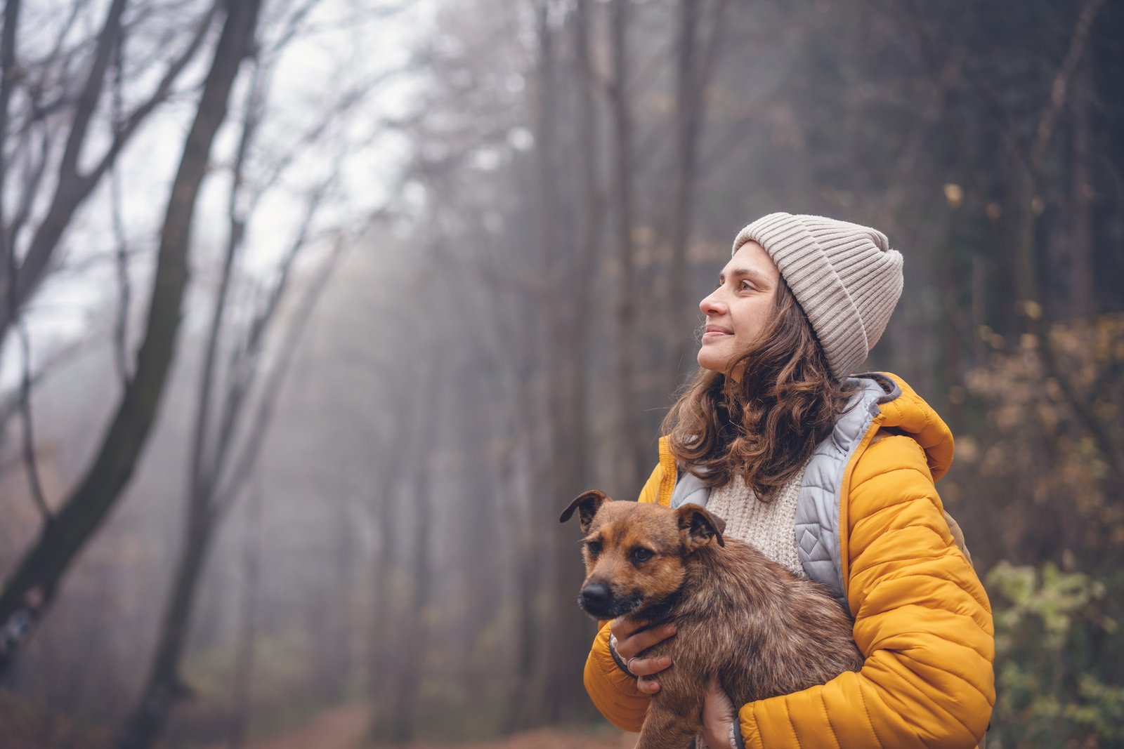 Woman with dog in forest